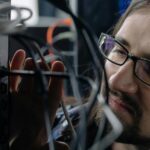 IT technician working in server rack for business infrastructure support